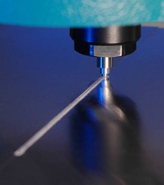 Figure 2: &micro;FSW in progress through 300&mu;m thick aluminium alloy sheet